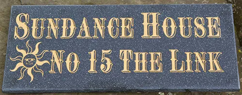 engraved corian house sign