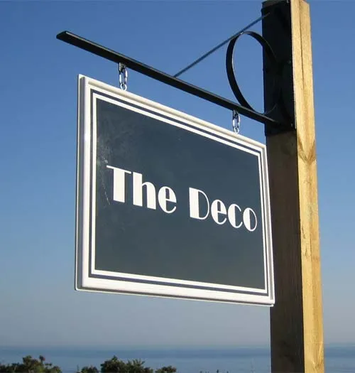 Hanging business sign in the Deco design