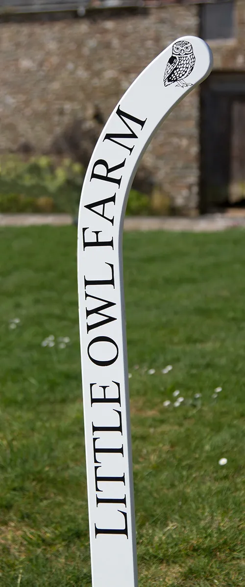 Painted wooden hockey stick sign