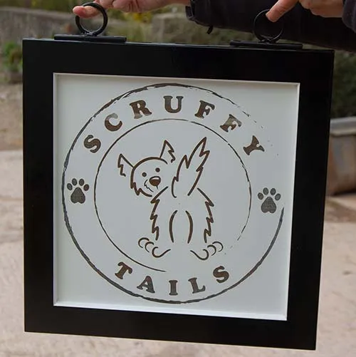 Black framed sign with printed panel