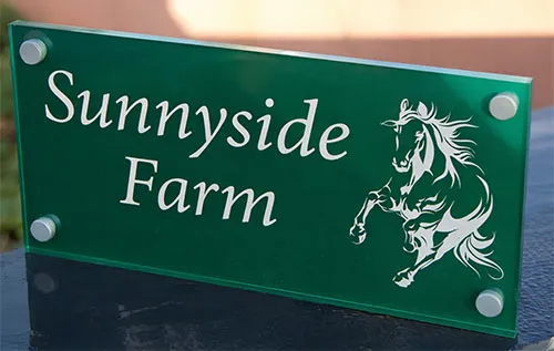 Reverse painted acrylic sign showing smooth glass-like front surface