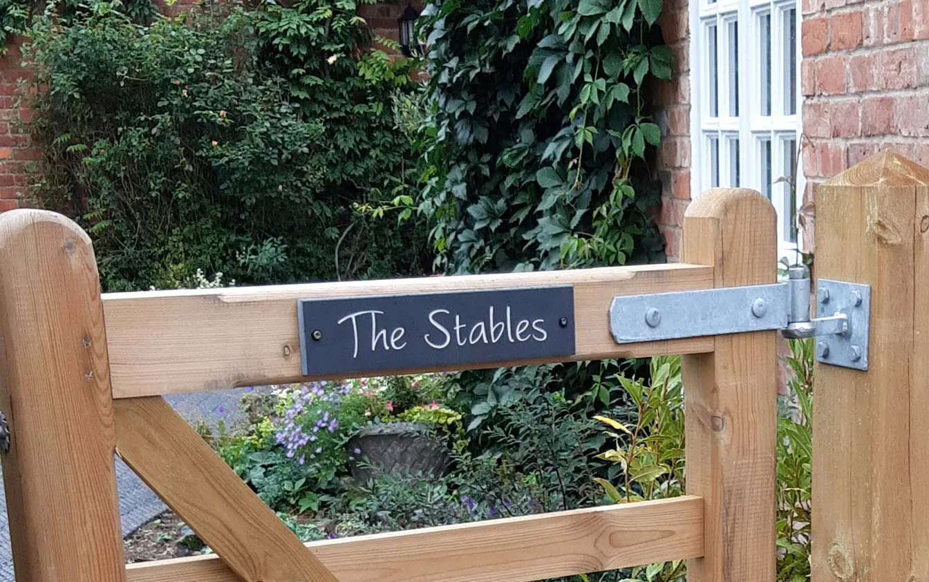 This was made in slate Customer photo of their gate sign