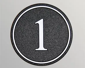 Round cast house number sign