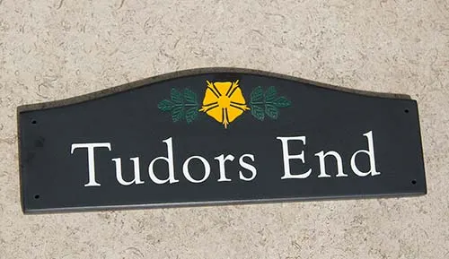 This sign included customers image in two colours. Engraved Corian House Sign