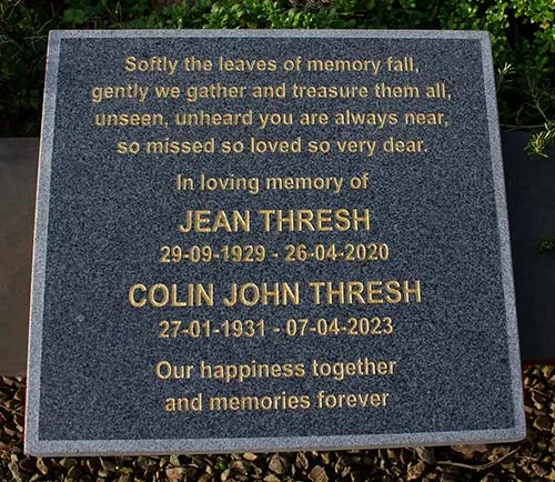 This granite memorial has a sandblasted border. Dark Grey Granite Memorial