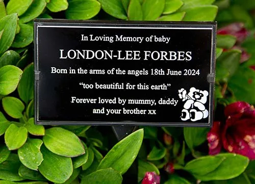 Black aluminium plaque in plaque holder. Black aluminium memorial