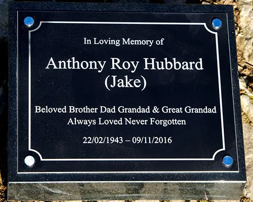 Black plaque on memorial wedge