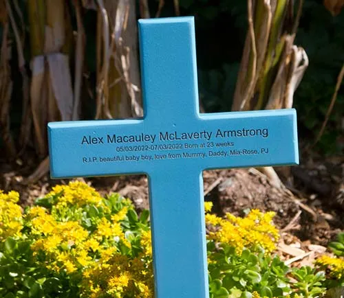 The lettering is laser engraved into the wood Blue Painted Wood Cross