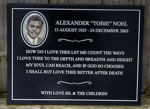 This porcelain photo was set into black corian. Oval Photo Memoial