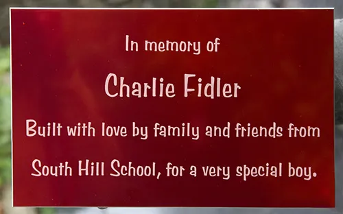 Red aluminium memorial plaque