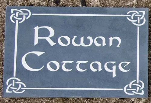Slate house sign with celtic border.