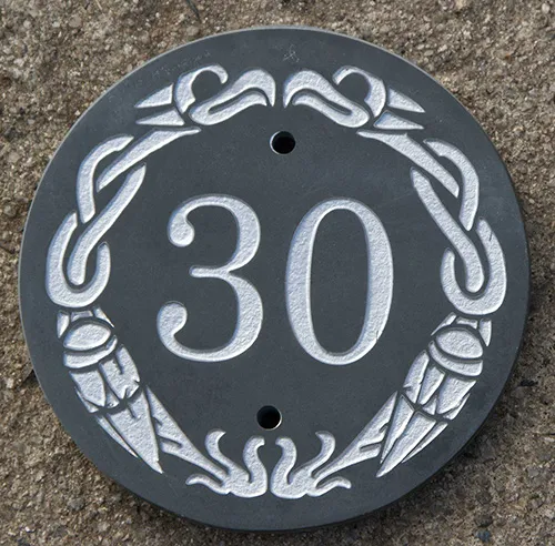 Round house sign with celtic border