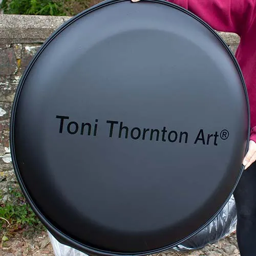 This wheel cover was wrapped in matt black before the black gloss vinyl lettering was applied Black on Black