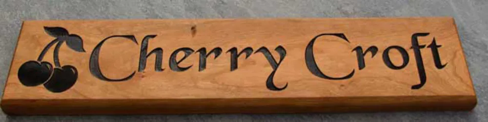 Wooden house name sign in cherry wood