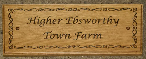 title here Wooden sign with fine lettering and detailed border