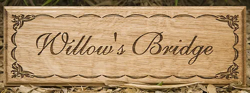 Wooden sign with fine lettering and detailed border