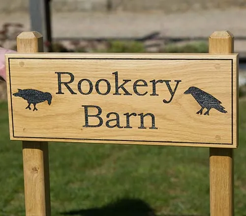 The fixing holes are pluged with oak Oak Sign Front Fixed to Posts