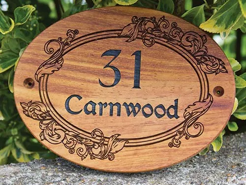 Oval wooden house sign