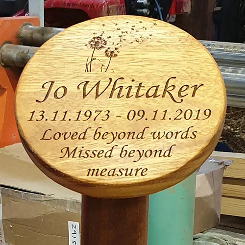 Round wooden memorial plaque