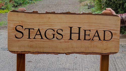 This rustic wooden entrance sign was fixed to two posts. Rustic Wooden Sign on 2 Posts