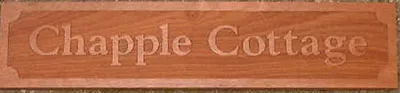 Sapele cottage sign with raised design