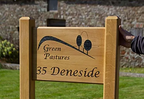 This sign has been varnished. Solid Oak Sign on Posts
