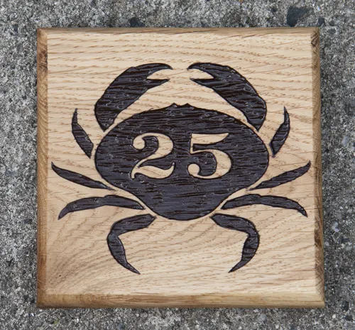 Wooden house number sign with image
