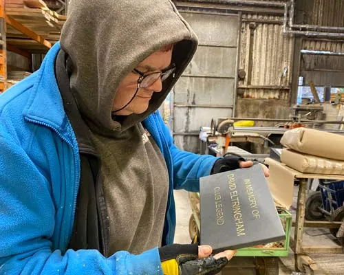 Slate memorial plaques can be made to any size. Caroline Inspecting Small Memorial