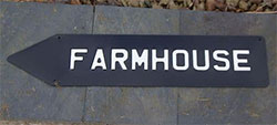 Embossed and enamelled arrow sirn.
