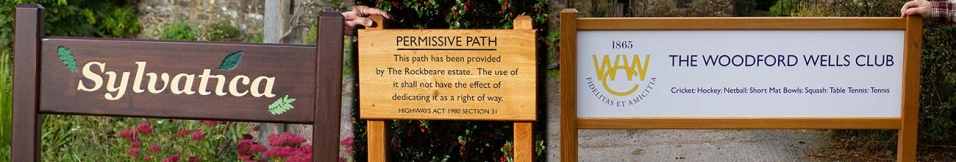 An assortment of signs on posts