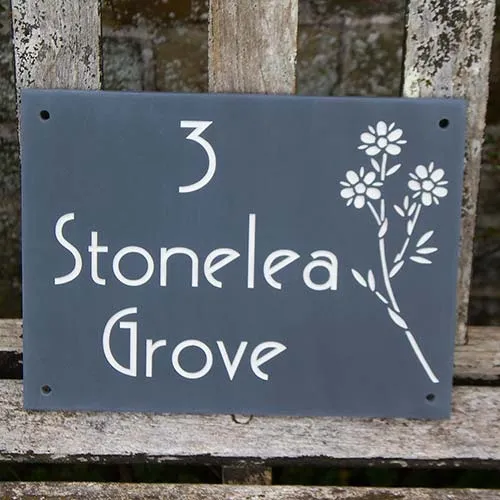 Interesting address sign with flower image. Slate House Sign