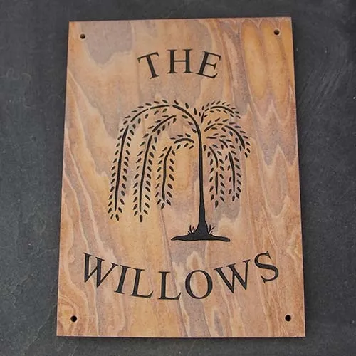 The unusual markings of this stone make for a very attactive sign. Sandstone House Sign