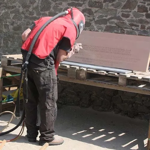 Sandblasting the wording onto a slate doorstep. Sand Blasting Slate Doorstep