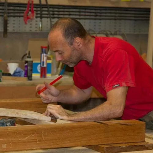 Our carpenters make the wooden signs just the way you want them. Carpenter at work
