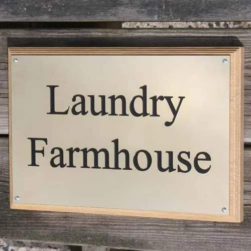 Engraved brass nameplate on a backing board. Engraved Brass Nameplate