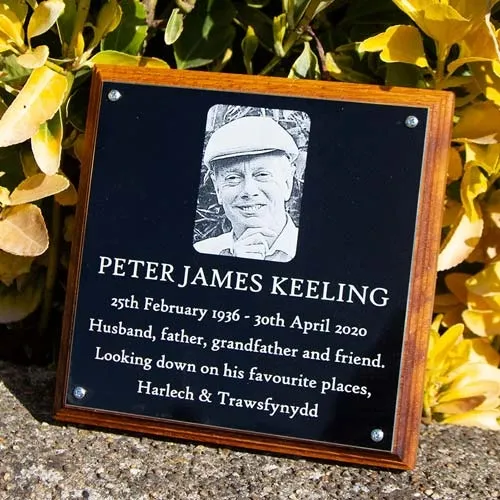 Engraved black aluminium plaque on backing board. Engraved Black Plaque