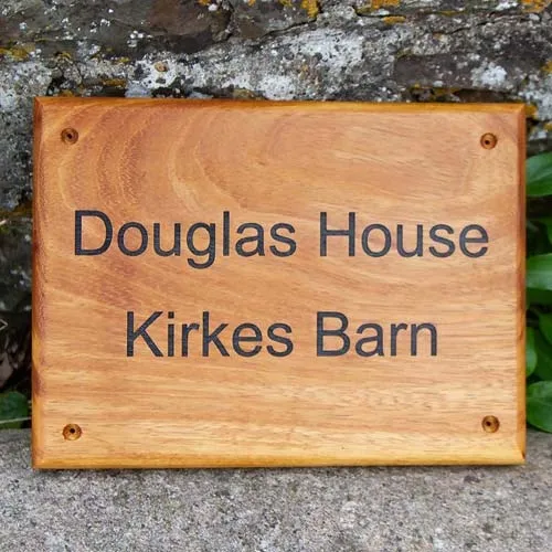 Iroko is similar to Teak - full of oil and durable. Irolo Wood House Sign