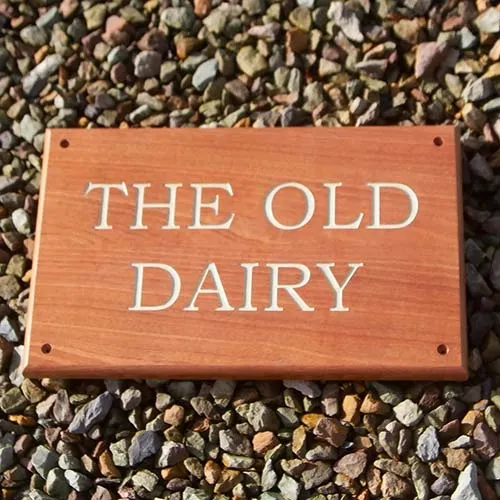 Sapele signs look great with white text. Sapele Wood House Sign