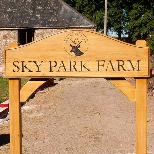 These signs on posts can be made virtually to any size and shape. Natural Wood Enrance Sign