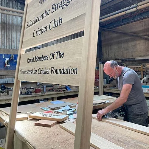 Oak sign with posts in the workshop. Large Oak Sign on Posts