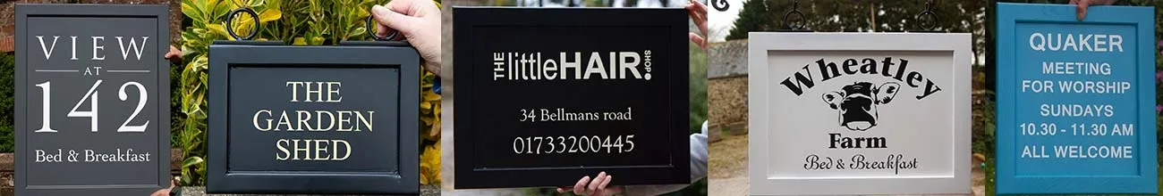 Painted wooden framed signs.