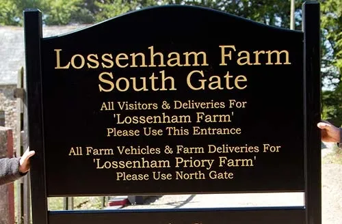 Painted sign board with gold text Painted Sign Board