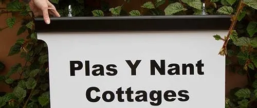 Aluminium framing top and bottom. Aluminium Framed Hanging Sign