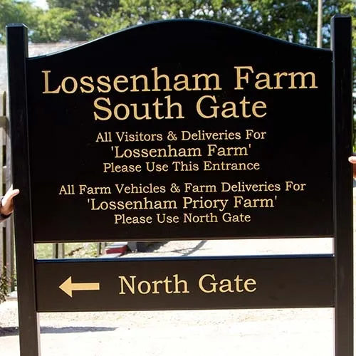 This sign was made using Tricoya board and attached to posts. Large Painted Sign.