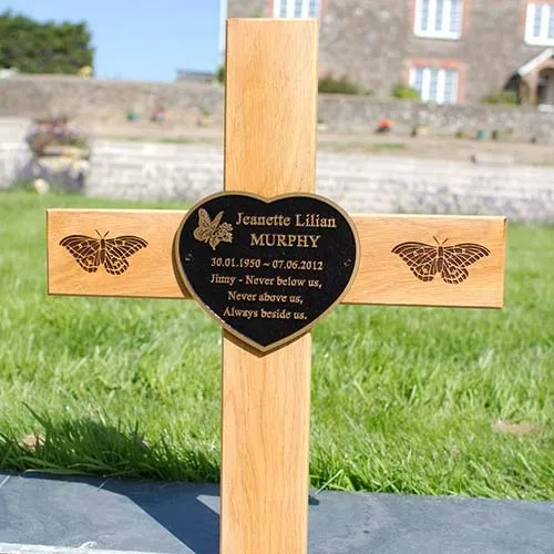 Bronze plaques, engraved plaques and photo memorials can be attached. Oak Cross with Bronze Heart