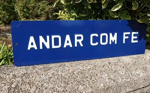 This is a Portuguese phrase meaning “walk with faith.” Embossed Aluminium Sign