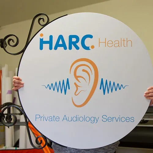 Projecting sign with cut vinyl lettering